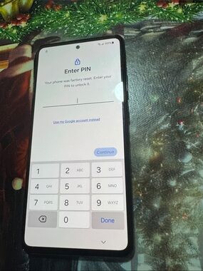 Samsung Black Android Smartphone with White PIN Screen